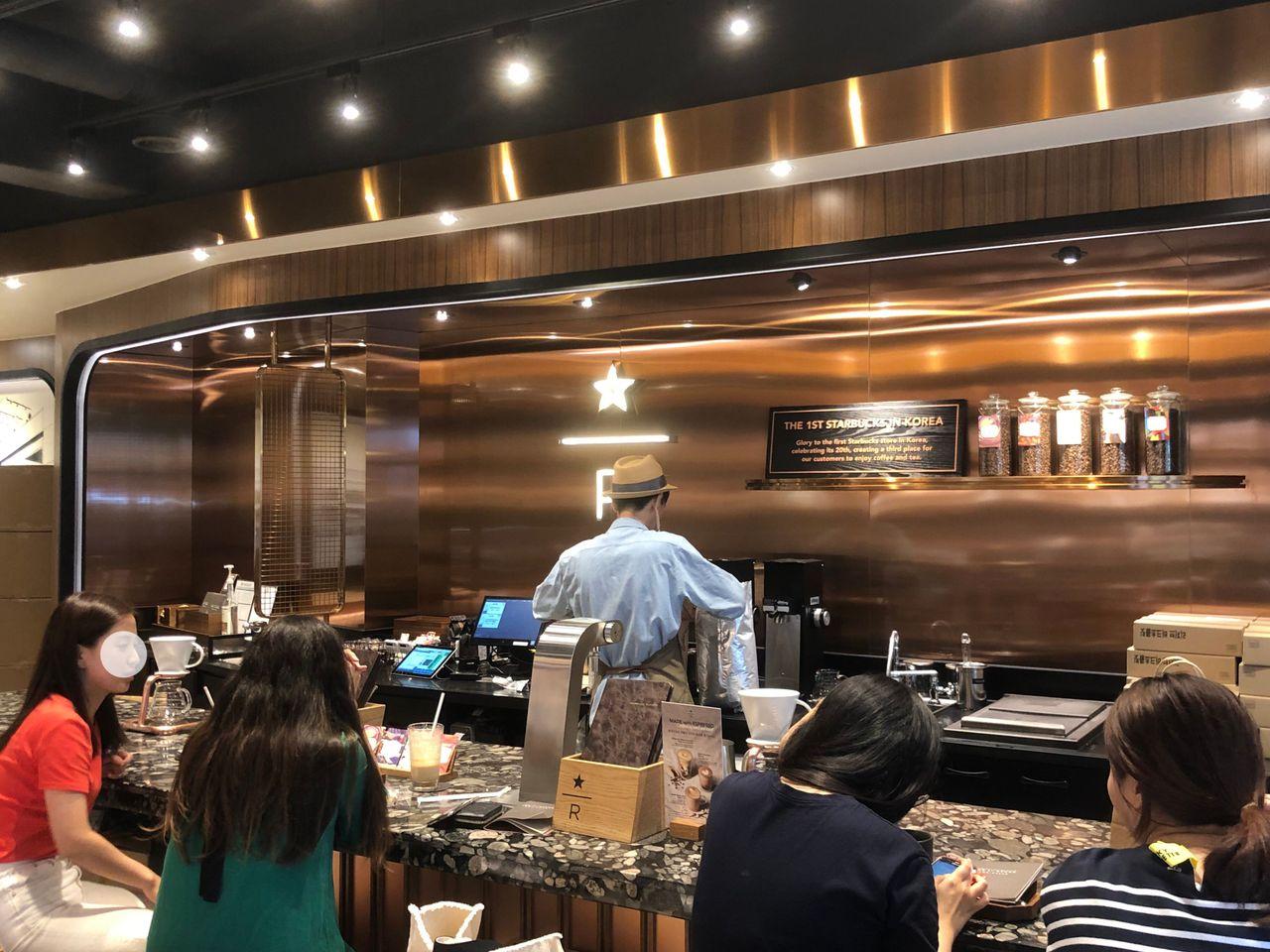 Interior view of the first Starbucks Korea, showcasing its modern and exclusive bar design.