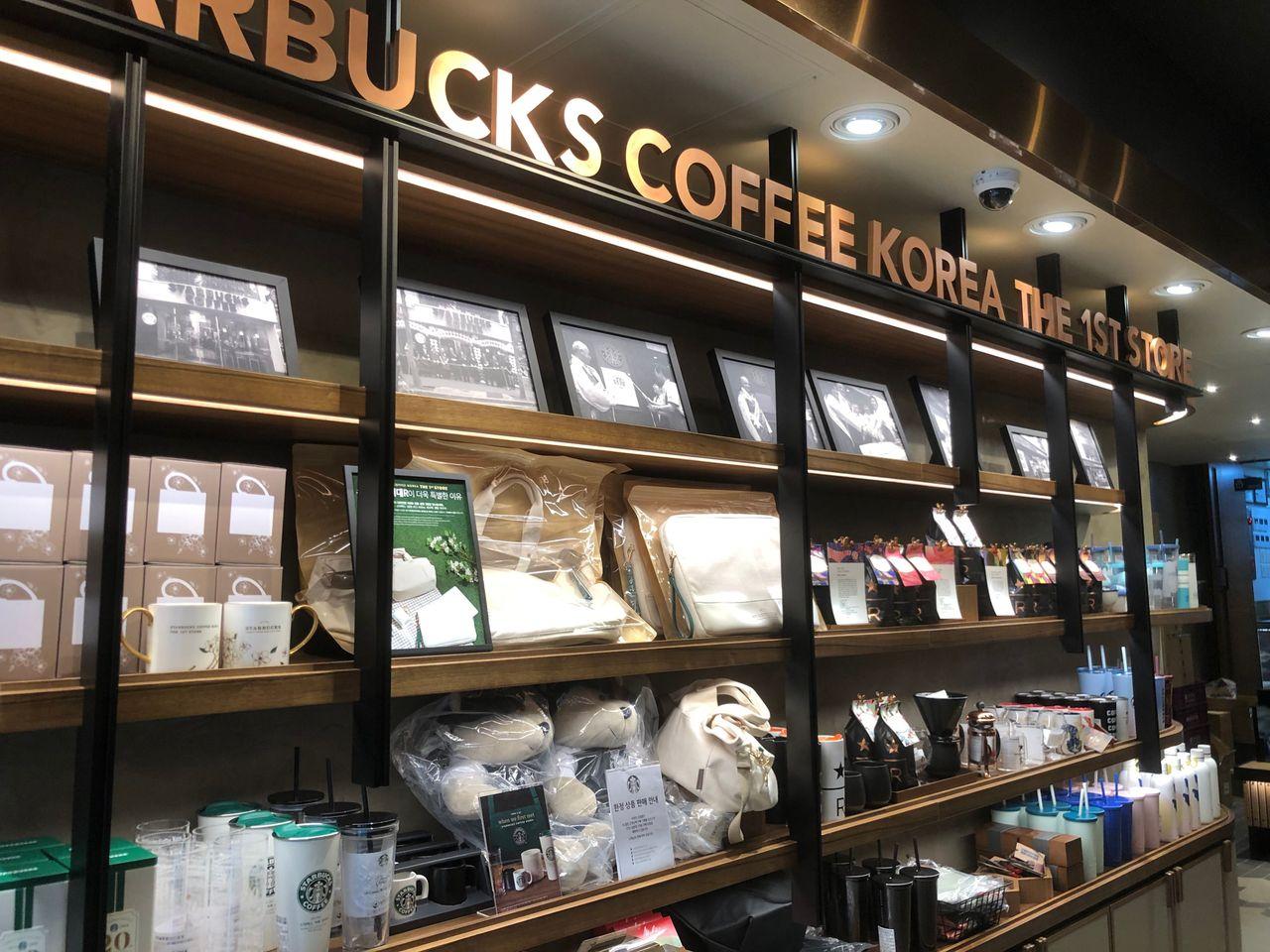 Starbucks exclusive products displayed, including the 20th anniversary merchandise at the first store in Korea.