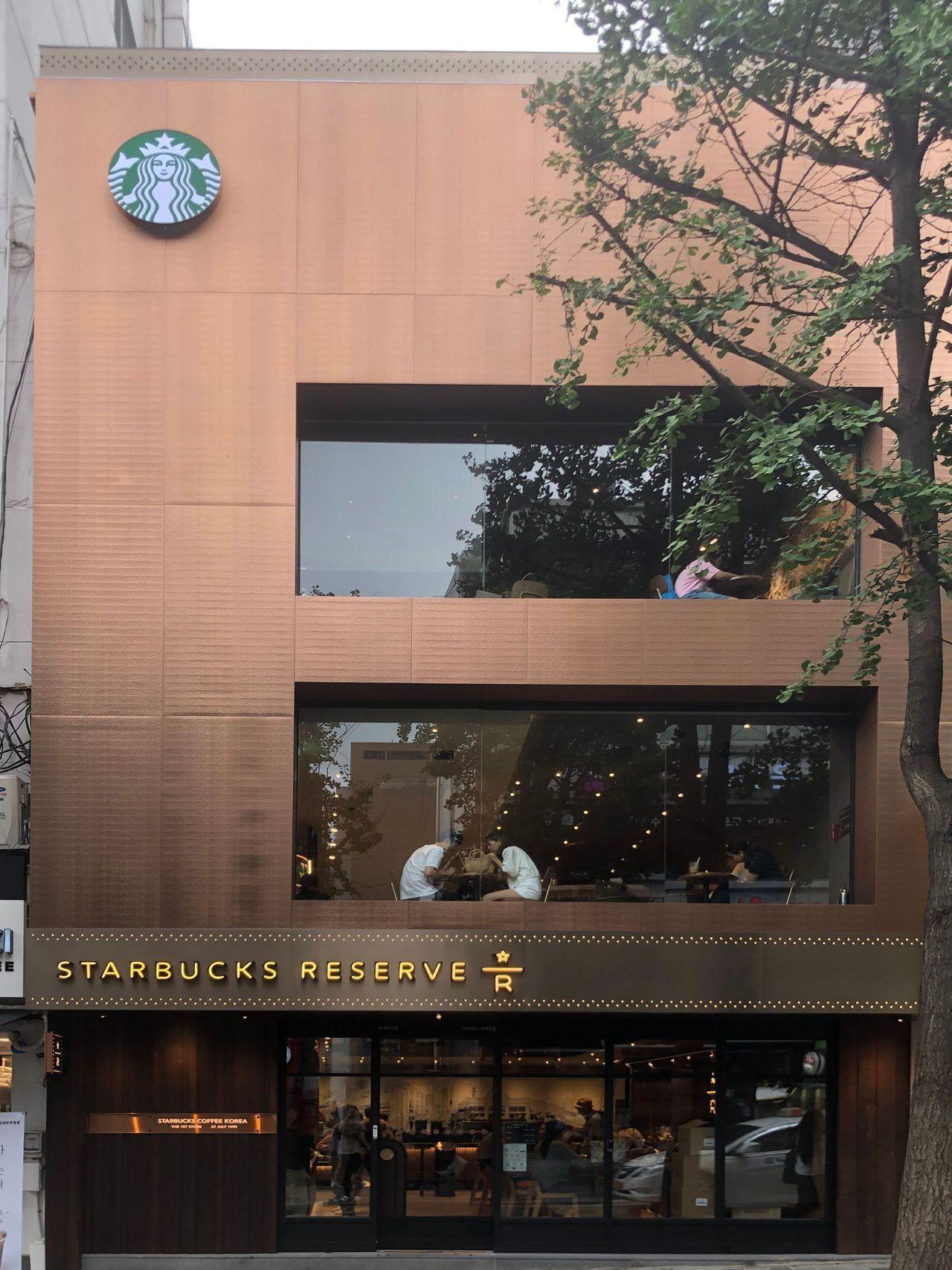 Unveiling the renovated three-floor Starbucks building, the first of its kind in Korea.