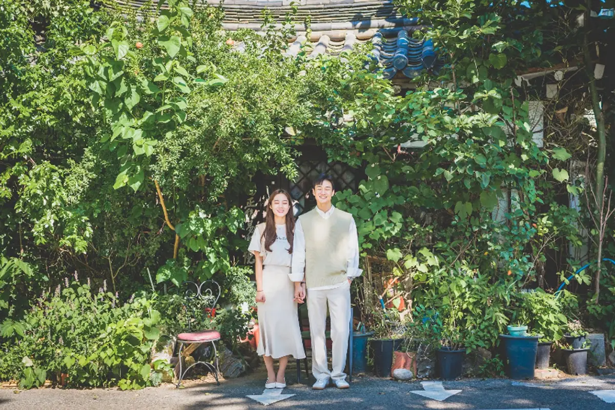 Person in hanbok experiencing the cultural richness of Korea.