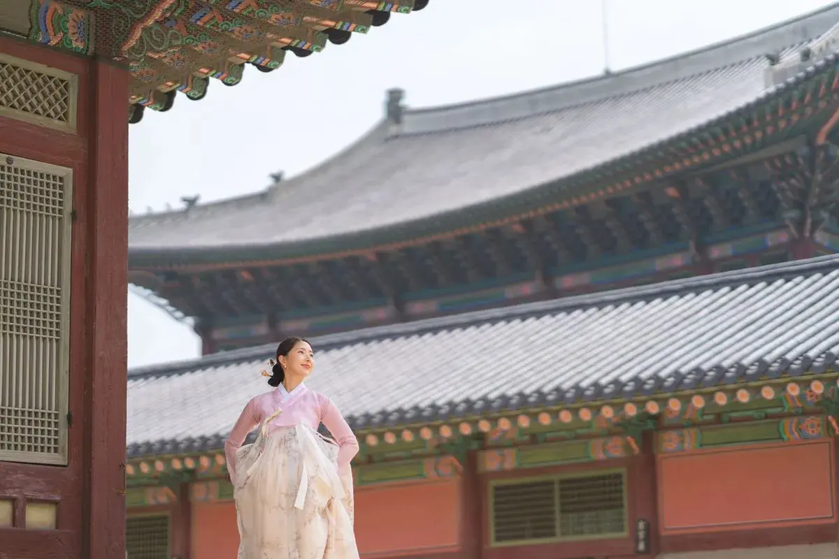 Outdoor photoshoot capturing the beauty of hanbok at Bukchon Hanok Village.