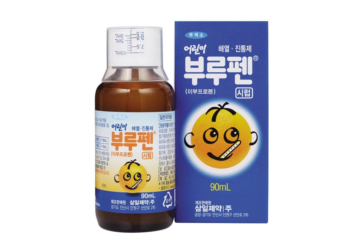 Hình ảnh chai si rô Brufen dành cho trẻ em với biểu tượng hình quả cam vui nhộn, minh họa thuốc hạ sốt cho trẻ nhỏ được đề cập trong bài viết tư vấn mua thuốc tại Hàn Quốc.