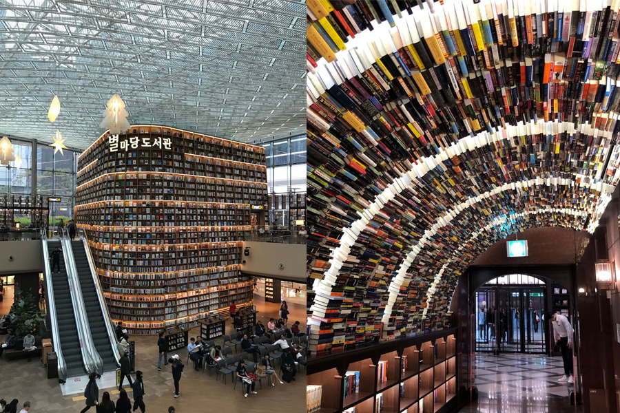 首尔图书馆的内部景观，大型的书架排列整齐，屋顶装饰着星星图案的灯。
