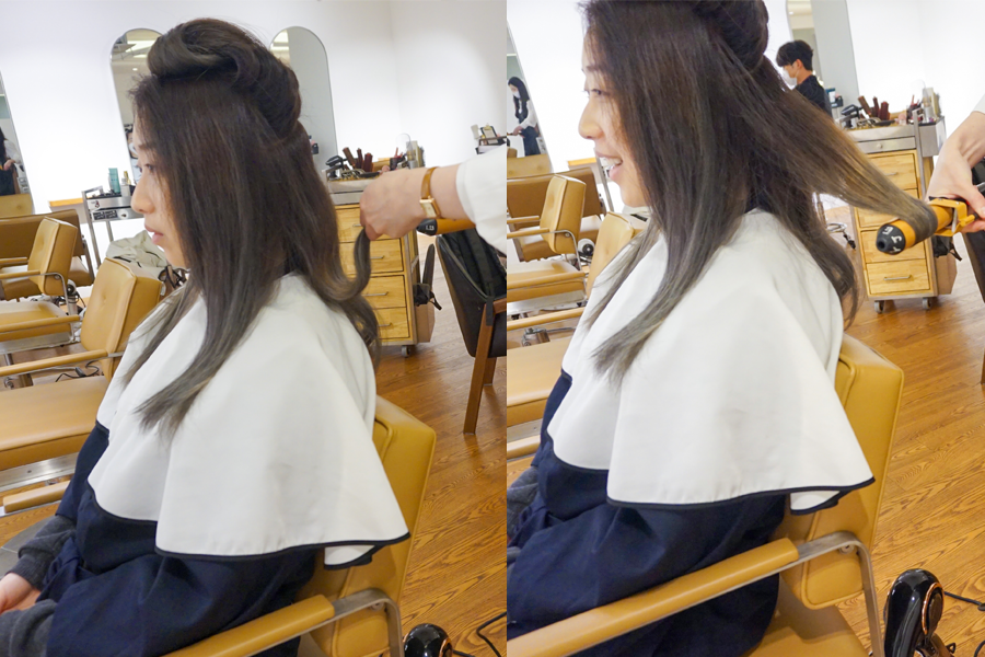 髮型完成後，顧客的頭髮被精心設計，AM:TON 髮廊的捲髮造型效果。