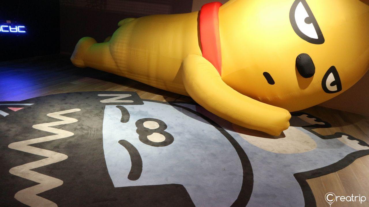 Large inflatable Kakao Friends character positioned in a fun seating area on the floor.