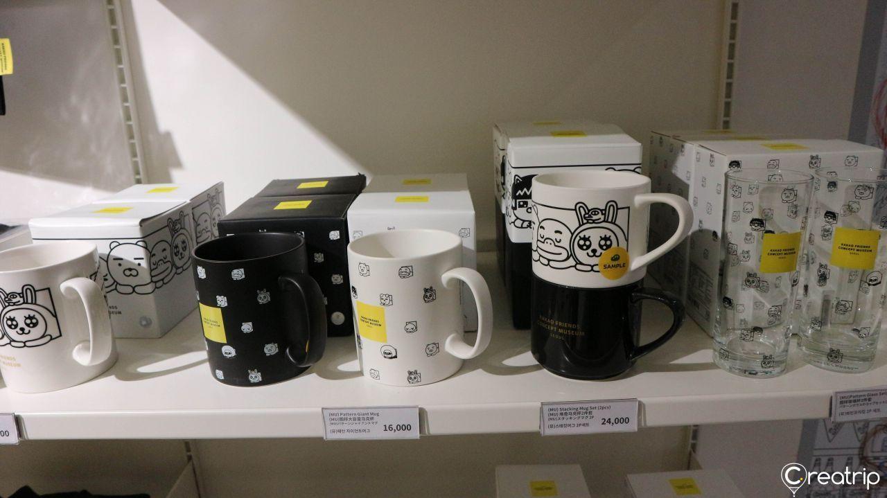 Customized Kakao Friends merchandise such as framed art portraits at a display stand.