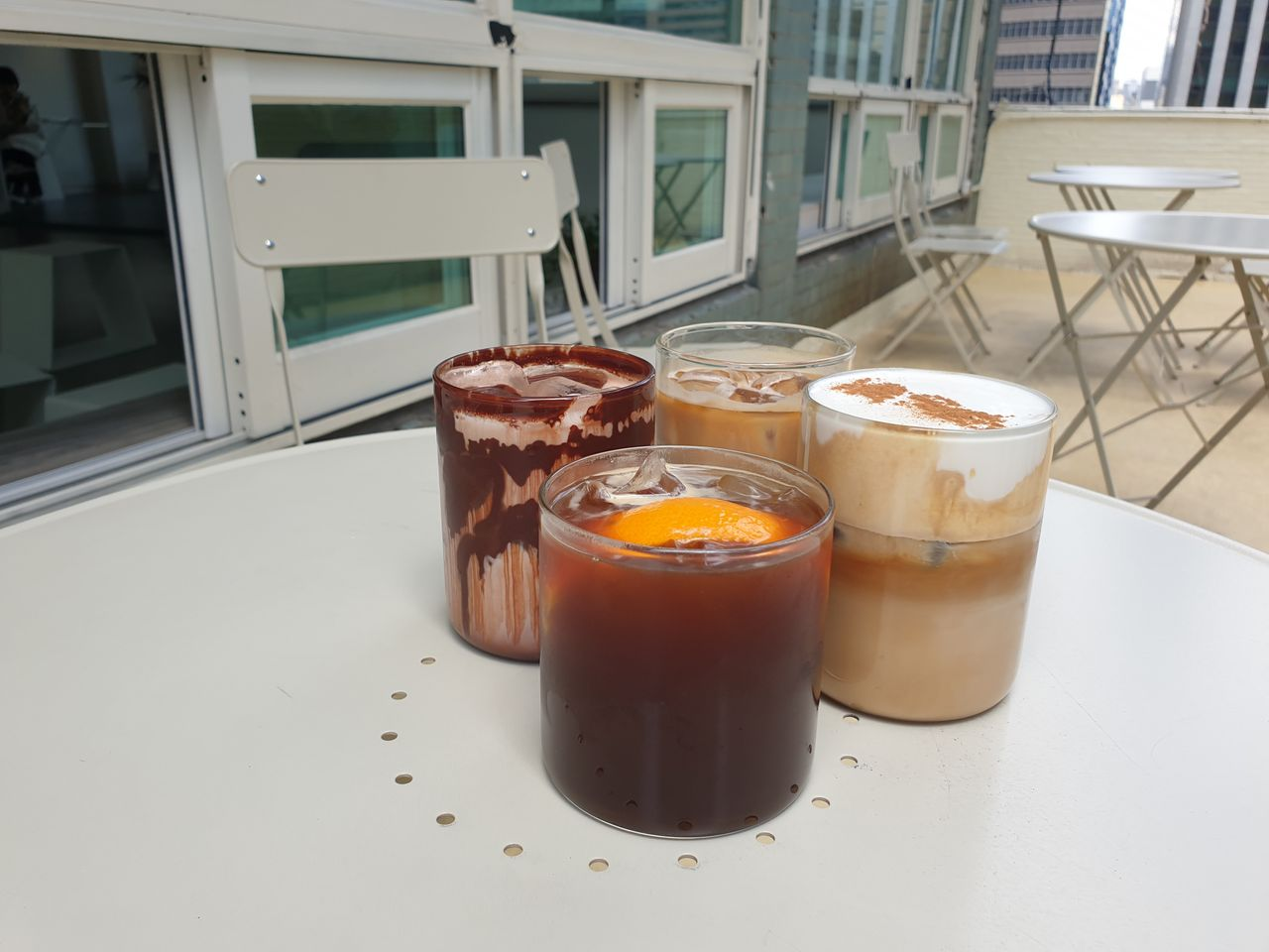 vacances | Euljiro 1-ga Cafe surrounded by tall office buildings with a resort-like atmosphere