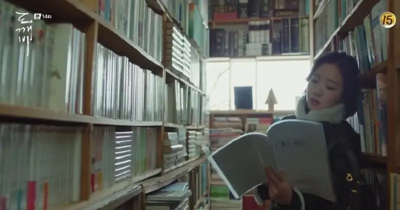Interior of Hanmi Bookstore filled with books on wooden shelves, Goblin filming location.