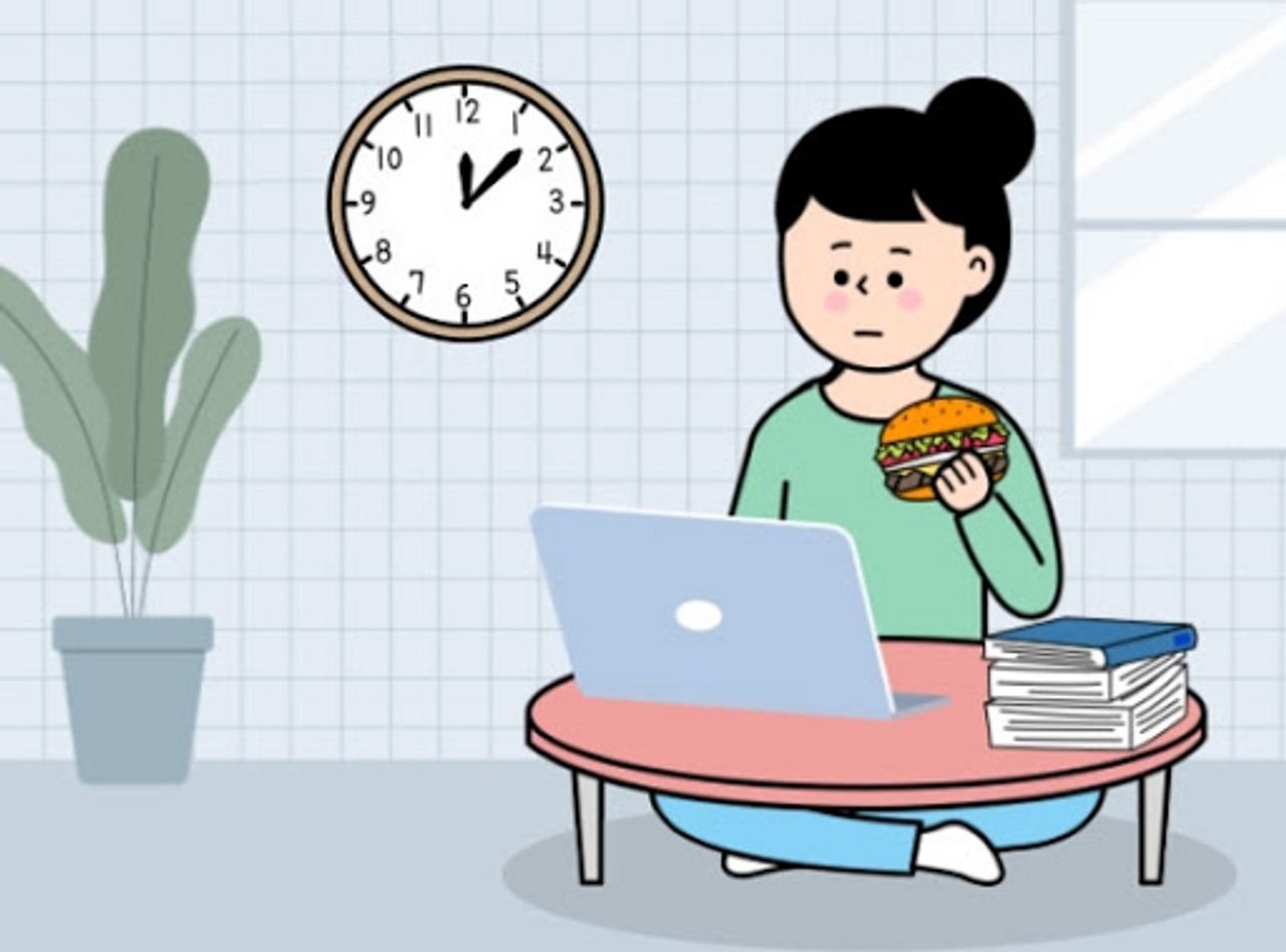 一位正在家中工作的插圖,人在電腦前,一手拿著漢堡,描繪了在宅經濟下的生活
