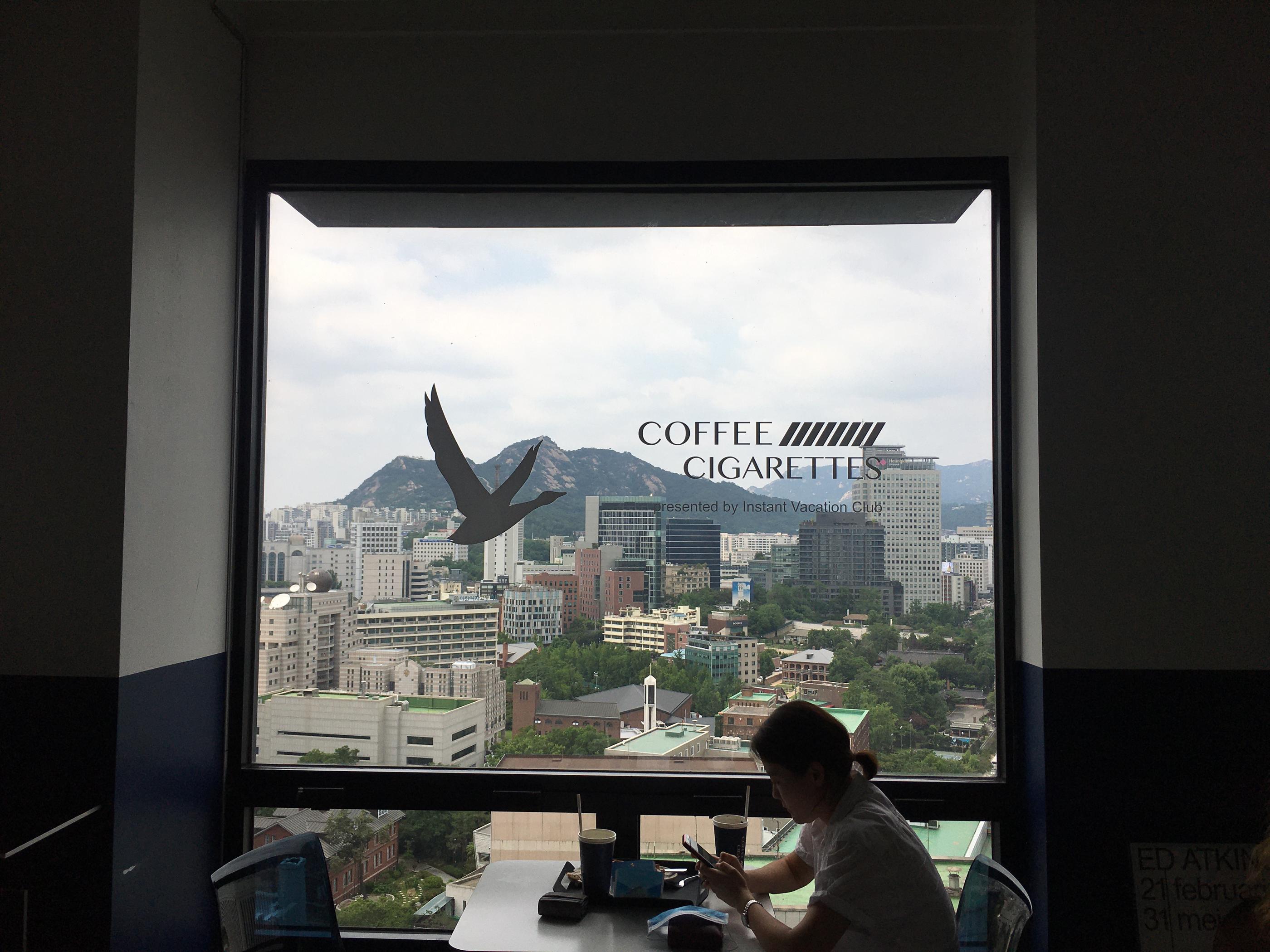 Take In The Stunning View Of The Mountains And The City At This High-Storey Cafe | Coffee And Cigarette | Seoul City Hall