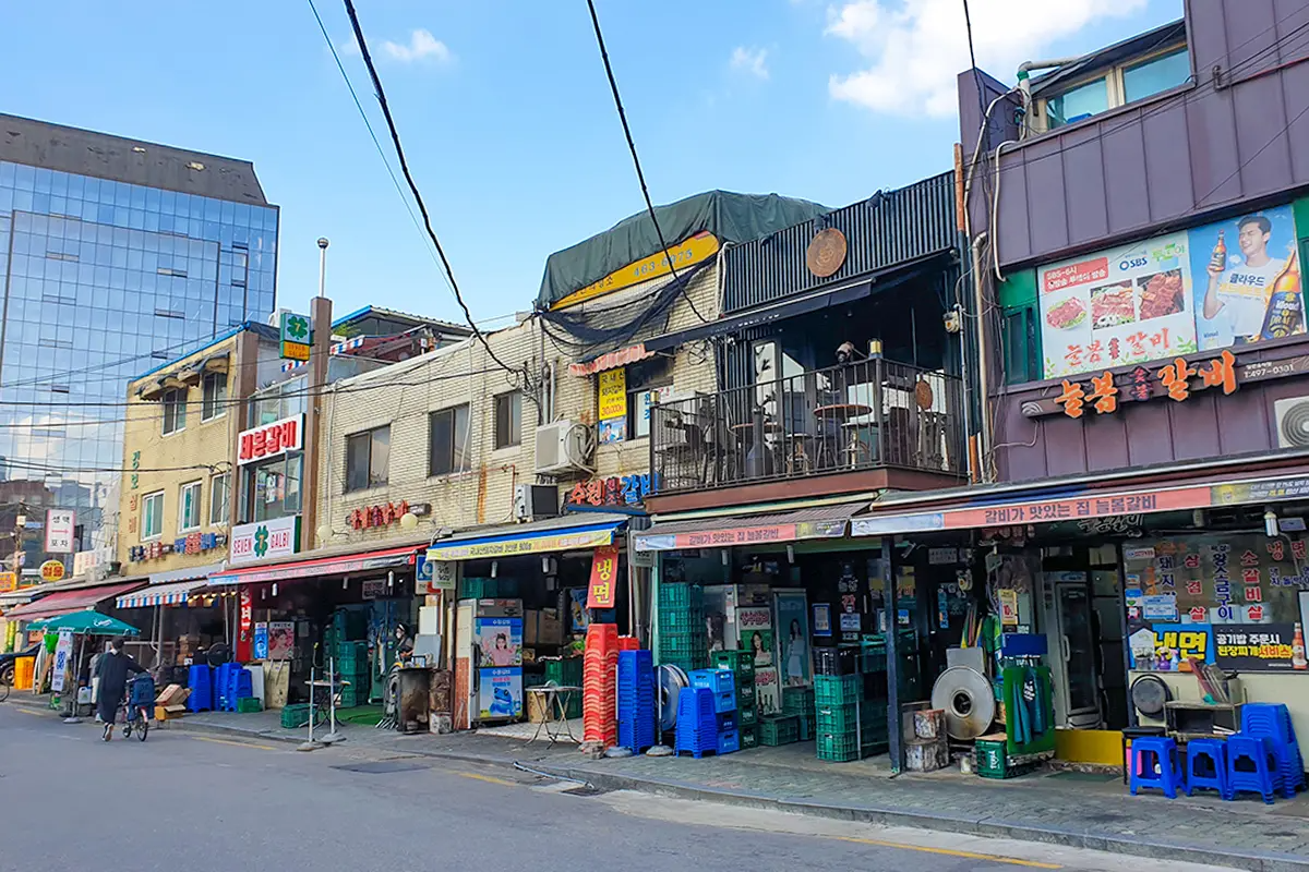 Street view of Seongsu's Galbi Alley, famous for traditional grilled ribs offered by various restaurants in the area.