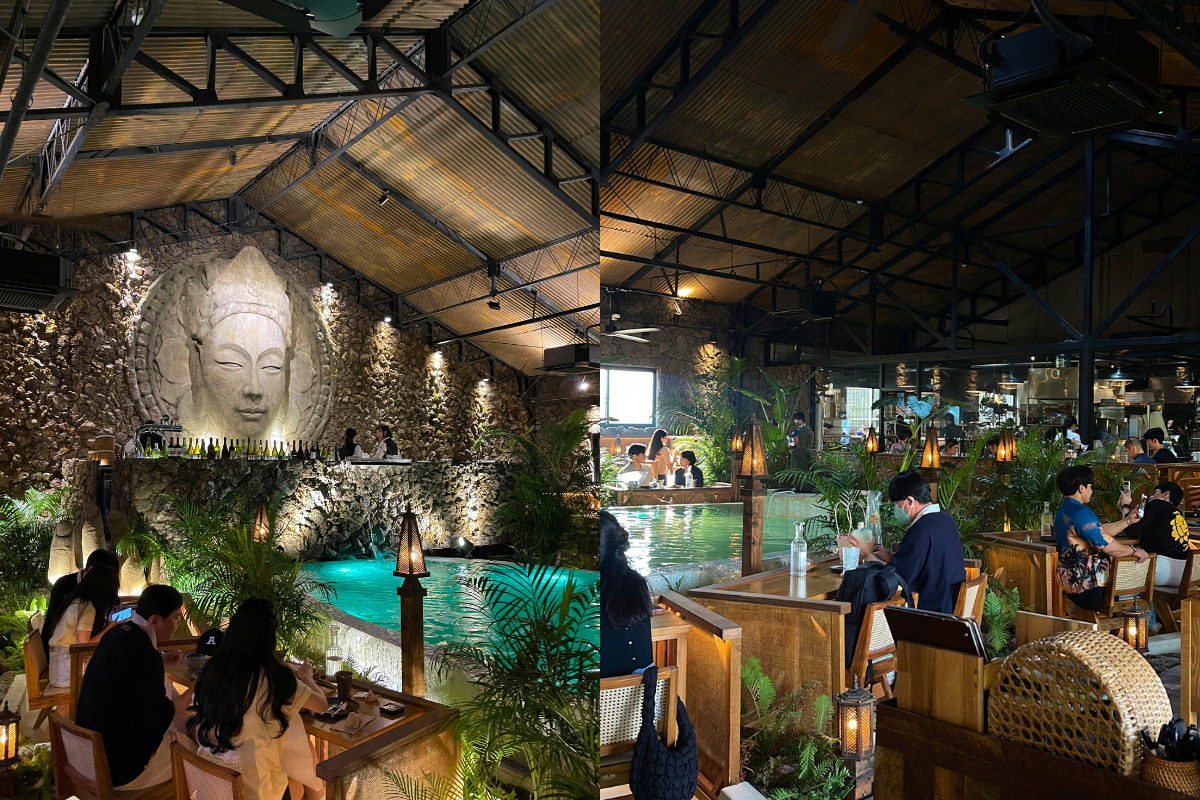 Saladaeng Temple's lavish interior in Seongsu, styled with tropical decor and a serene water feature for a Thai dining experience.