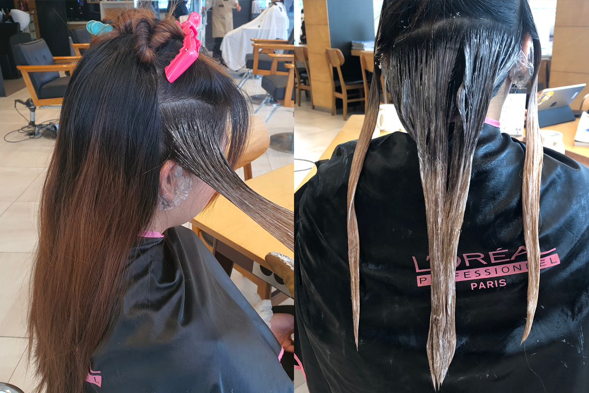 MERCY HAIR进行美发护理的过程中，一位顾客的头发被分段处理。