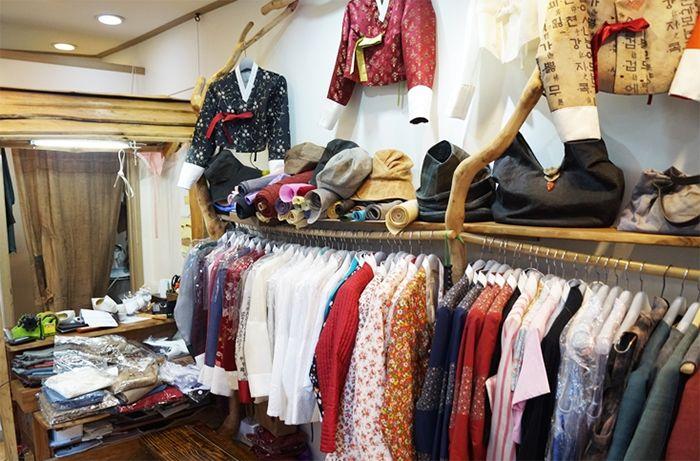 Interior of a hanbok shop with an array of modernized traditional Korean dresses