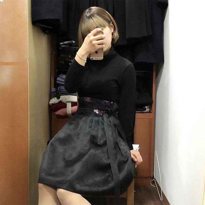 Arrangement of intricately designed hanbok jackets in a traditional setting