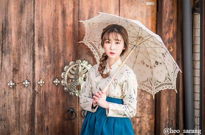 Modern hanbok dress displayed in a stylish boutique with artistic flair