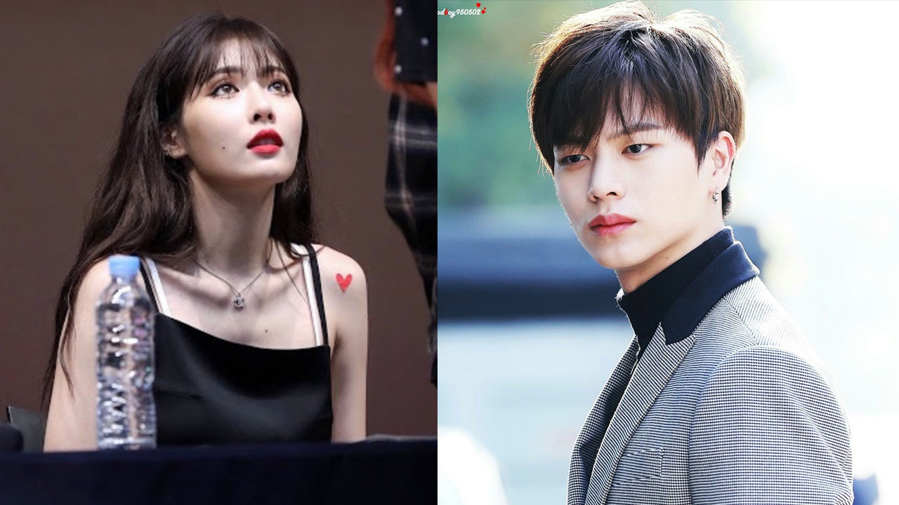 Cube娛樂性感風格，一位模特穿着無袖黑色連衣裙，另一位模特身穿灰色西裝外套，兩人展示出成熟與誘人的氛圍。