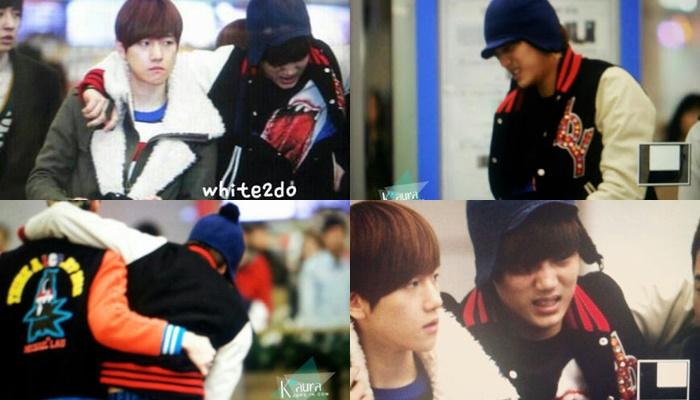 ไอดอลสวมชุดแจ็คเก็ตทำจากหนังกับกระเป๋าถืออยู่ในสนามบิน