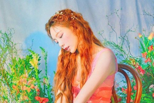Taeyeon with flowers in background