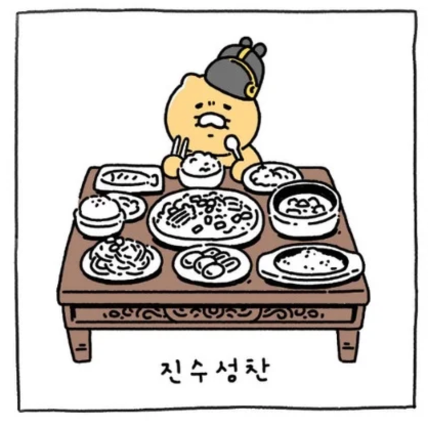 Ryan坐在滿滿一桌菜餚前面，但看起來很擔心不受貓咪喜愛。