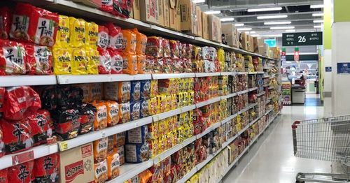 Interesting Facts About Korean Food Companies! Samyang Are Considered Traitors? Which Company Released The First Korean Chewing Gum?, instant noodles on display at a korean supermarket