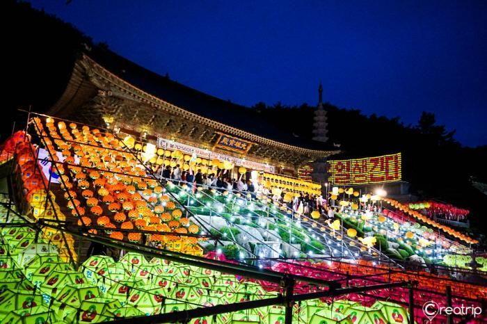 Variety of glowing lanterns hanging down, creating a dazzling tunnel of lights at Samgwangsa Temple.