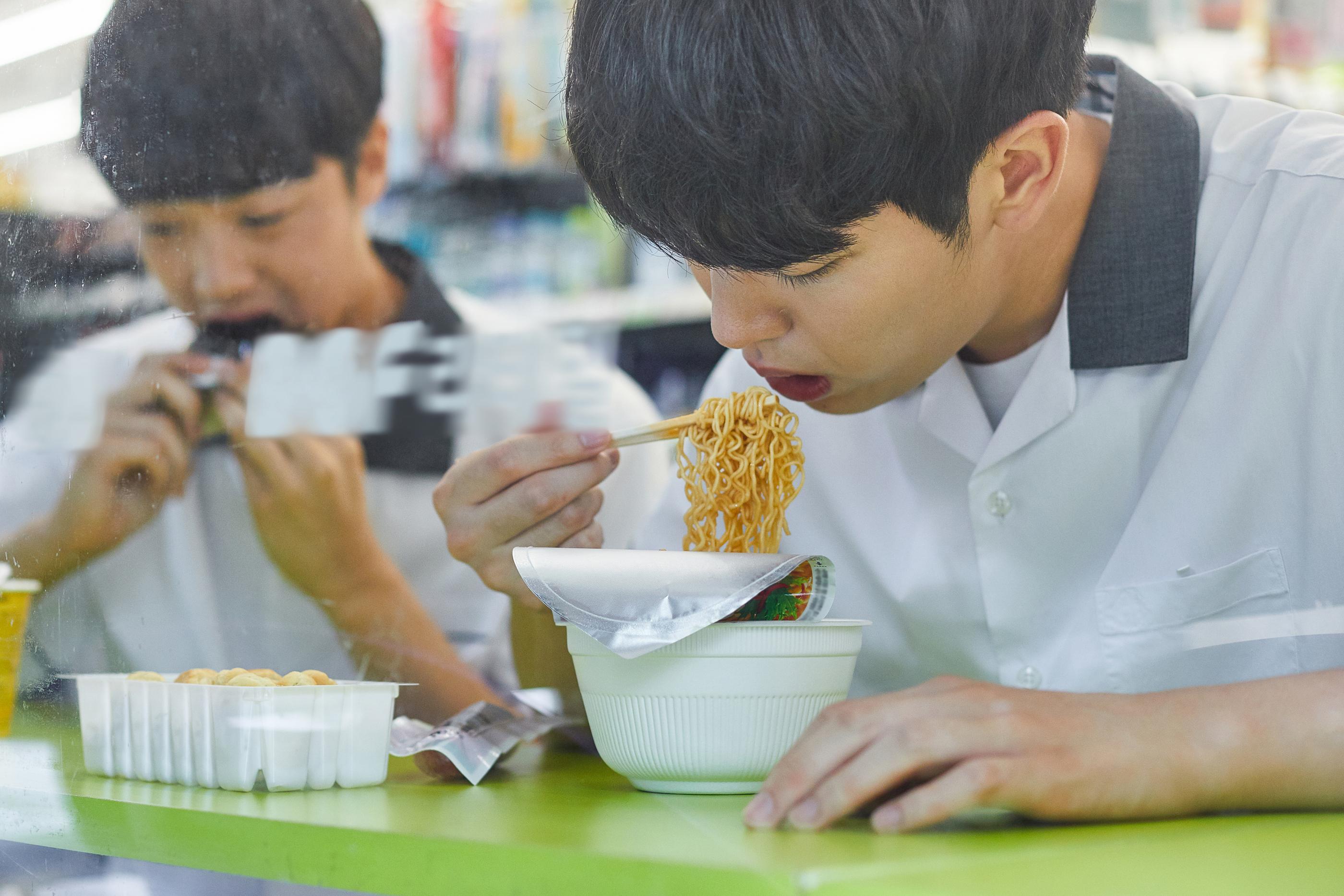 South Korean school kids enjoying instant noodles