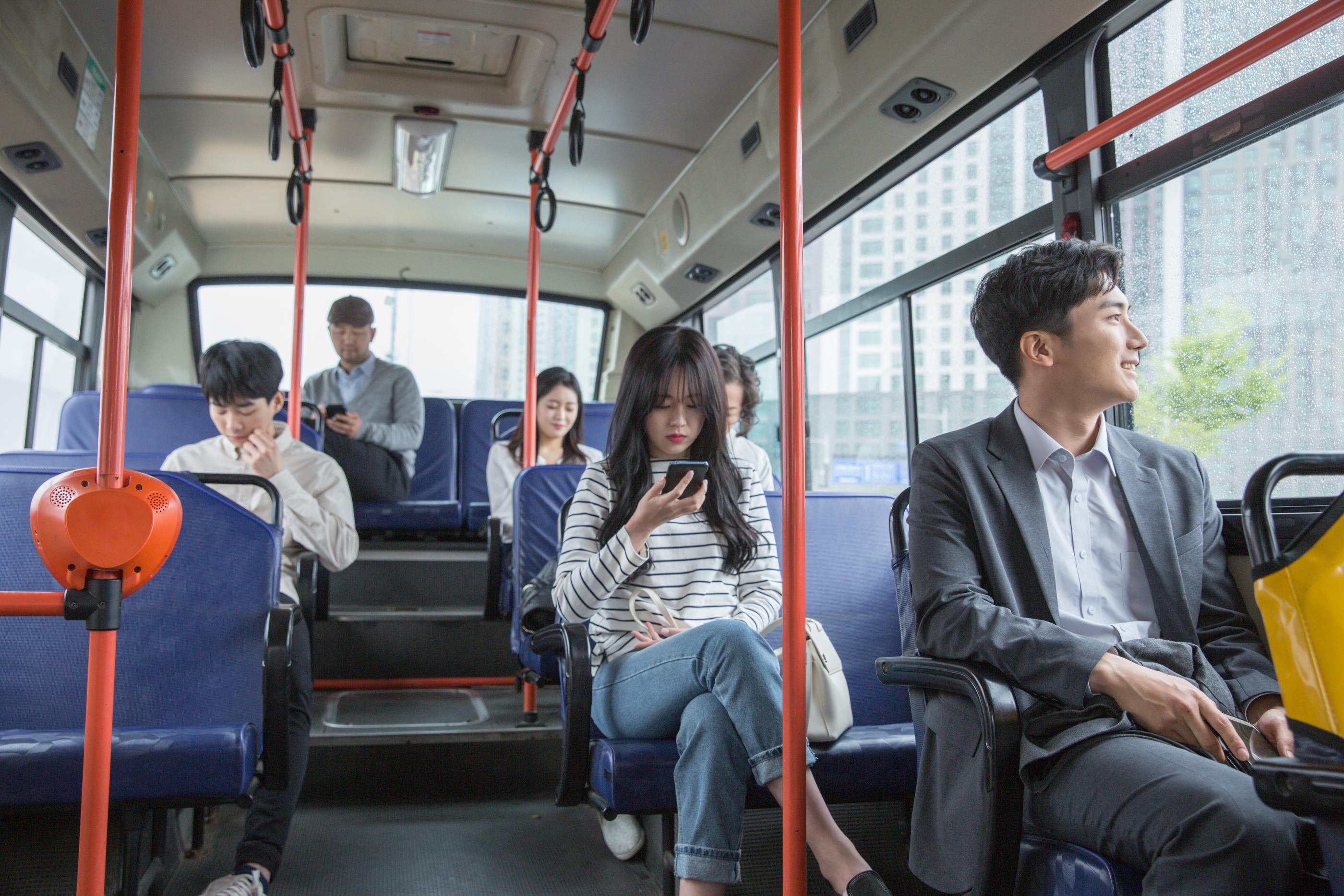 People on bus in Seoul, South Korea