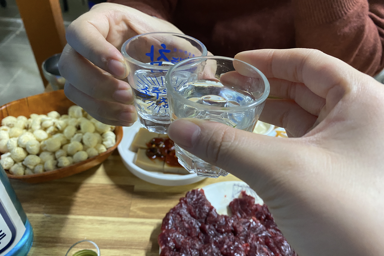 cheers! two soju glasses cheering