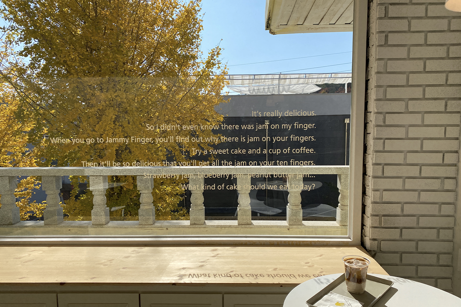 the view overlooking the yellow fall leaves from jammy finger, a daegu palgongsan cafe