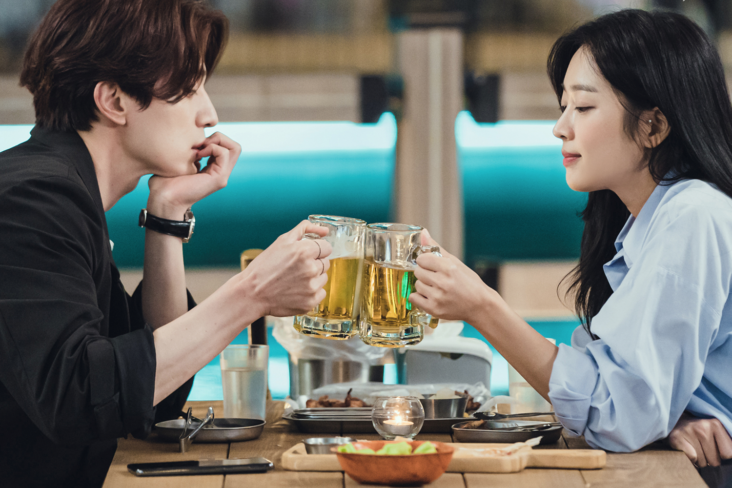 lee dong wook and jo boah toasting with beer in the korean drama tale of the nine tailed