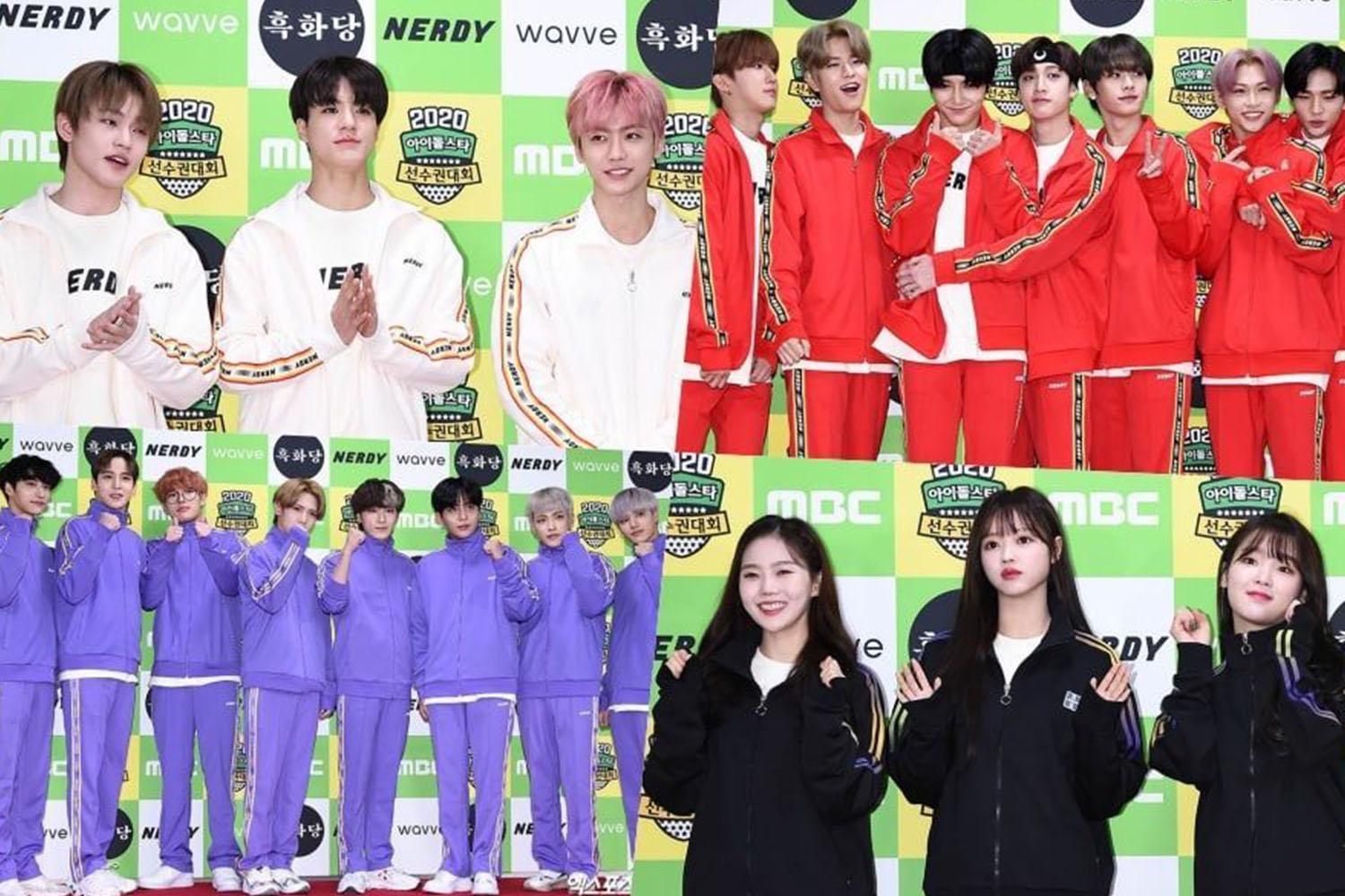 กลุ่มไอดอลและนักร้องในชุดวอร์มหลากสีที่งานประกาศผลรางวัลดนตรี