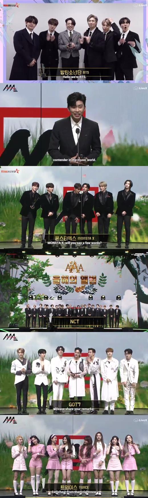 韓国の大人気グループBTSがアジアアーティストアワード2020での受賞スピーチの様子。メンバーたちはスーツを着ており、感謝の言葉を述べている。