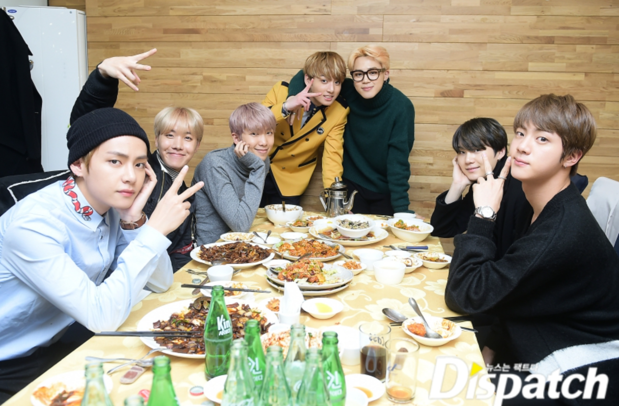 bts members at the chinese restaurant celebrating jungkook