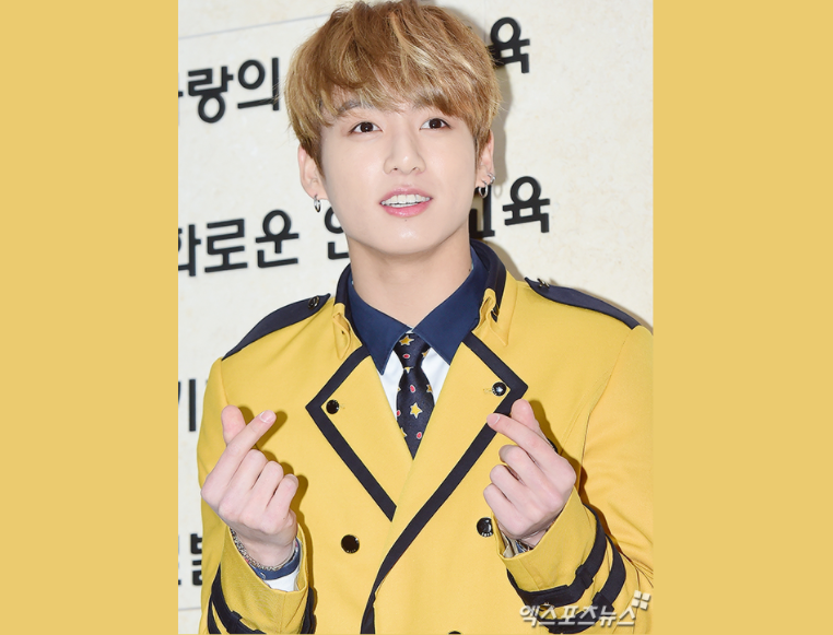 jungkook in his yellow uniform at school of performing arts seoul