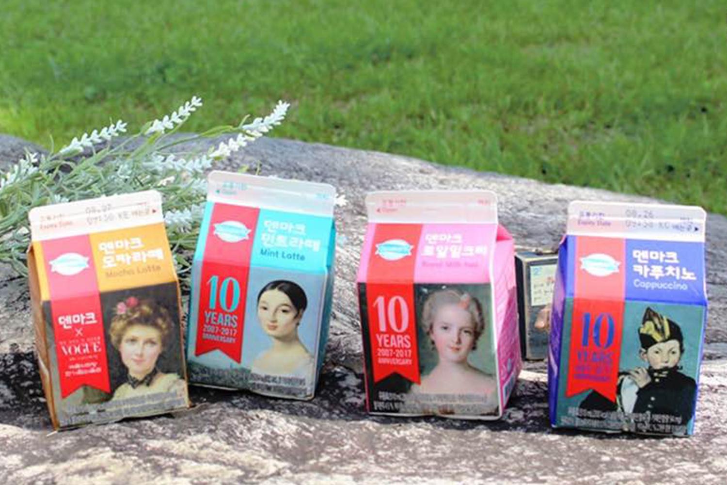 丹麥牛奶中，包含瑪倉、薄荷拿鐵、卡布奇諾等四種口味，展示在户外的草地上。