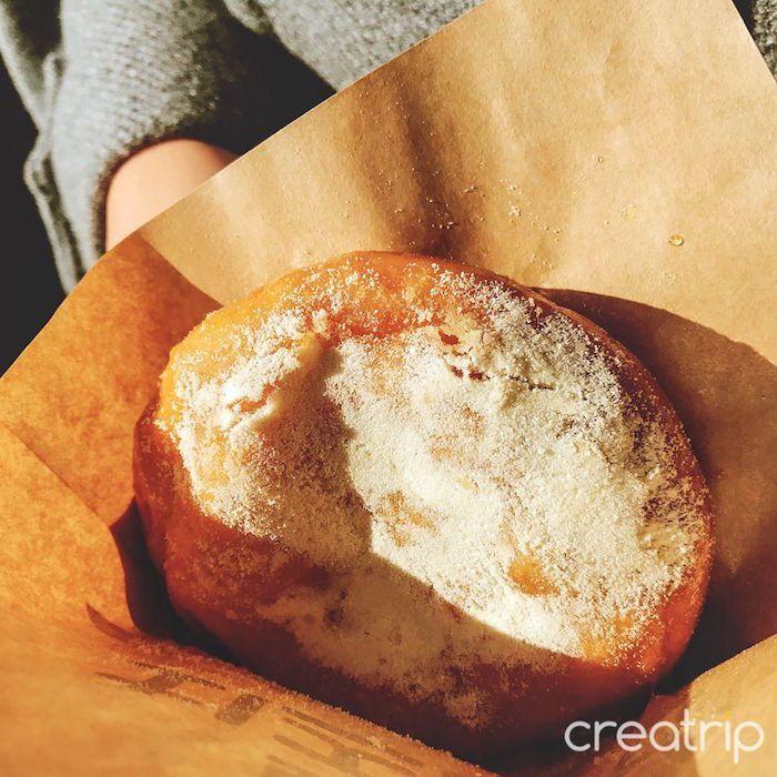 Mozzarella cheese-filled honey bread dusted with powdered sugar in Tongyeong.