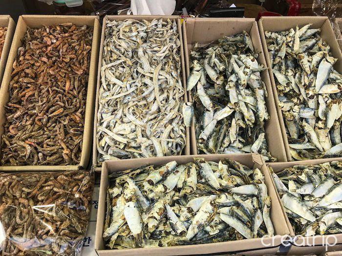 Dried seafood including shrimp and small fish available in Tongyeong's market.