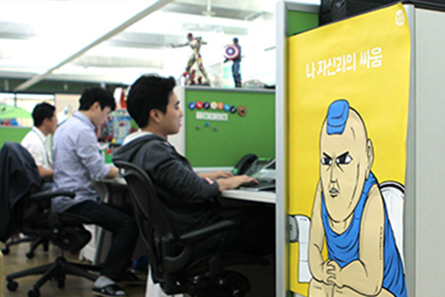 group of korean webtoon staff working on a webtoon