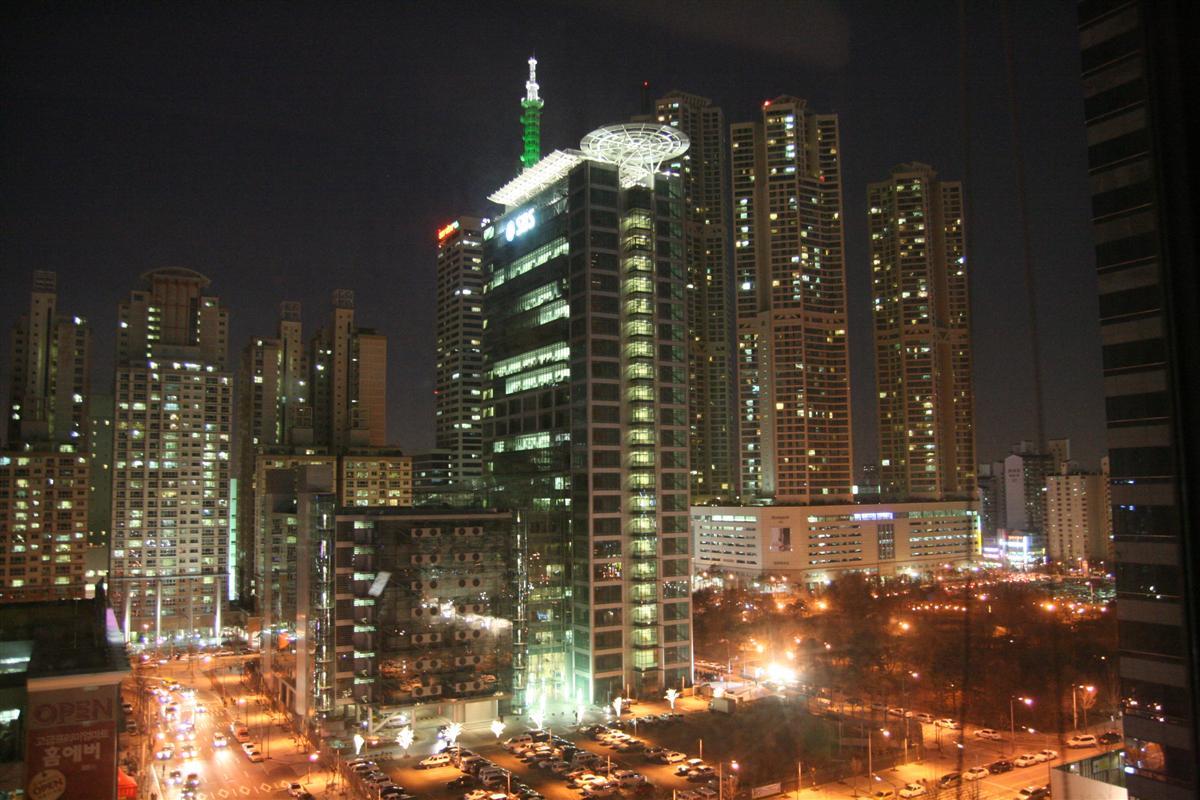 tall apartment buildings lit up at night in yangcheon-gu seoul korea