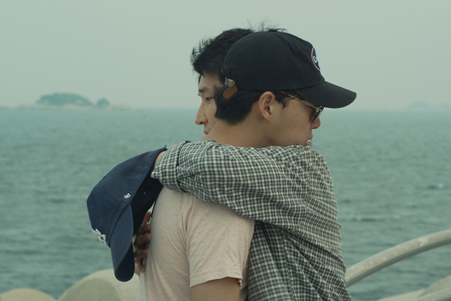 two men who are in love with each other living in a conservative country south korea, old-fashion styled movie, vintage film aesthetic