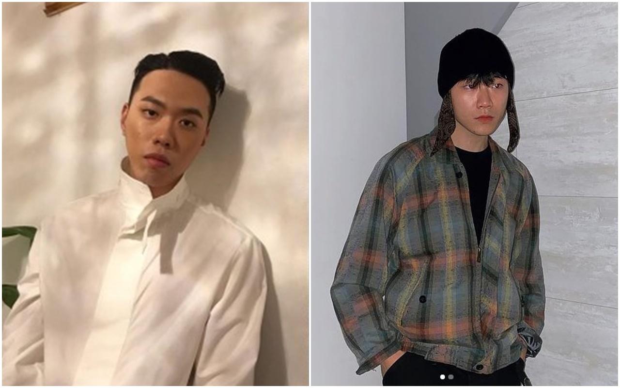 白いシャツを着たBewhY。彼の姿勢はリラックスしており、穏やかな背景が印象的です。