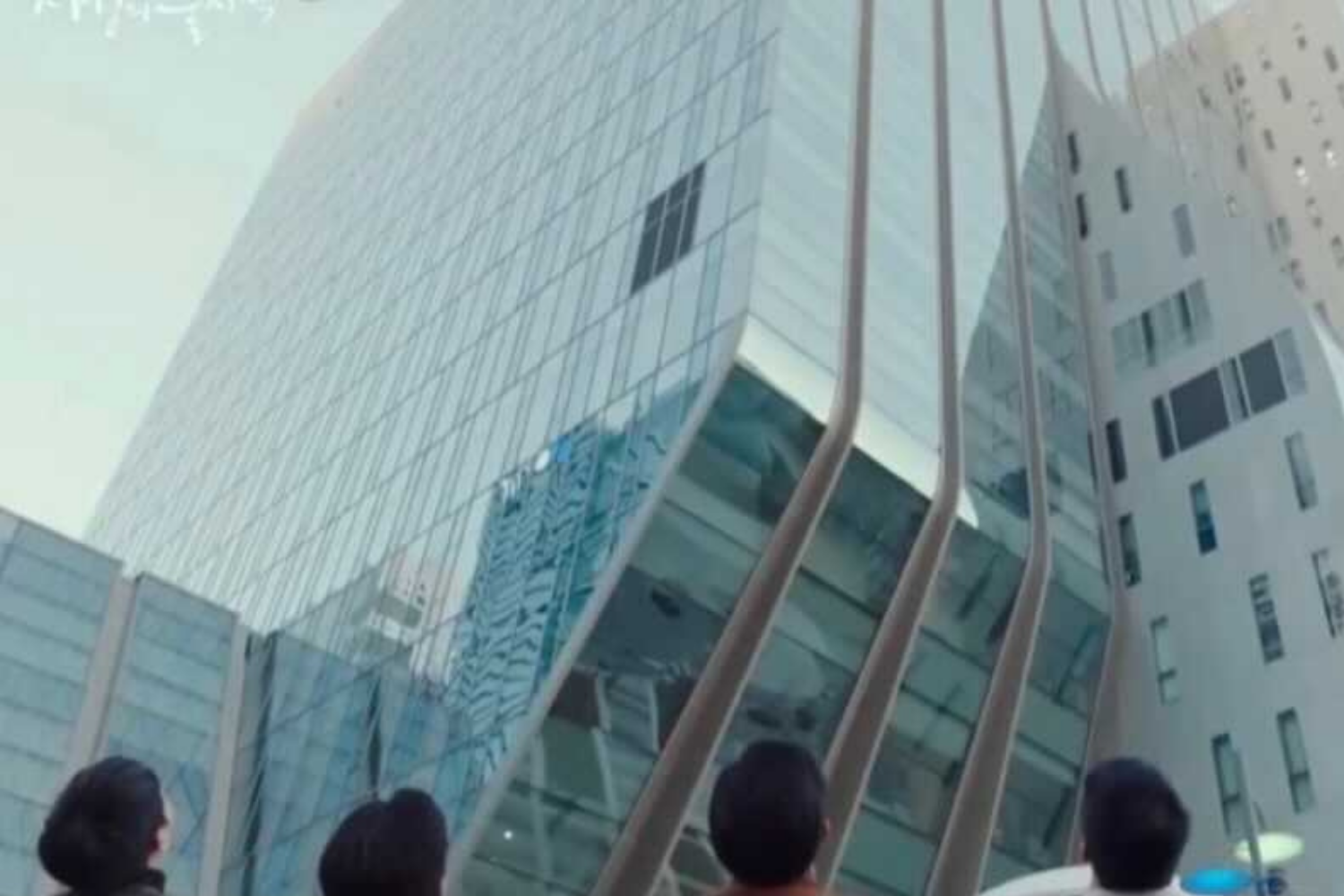 Company Five looking up at the DDMC office building in Crash Landing On You