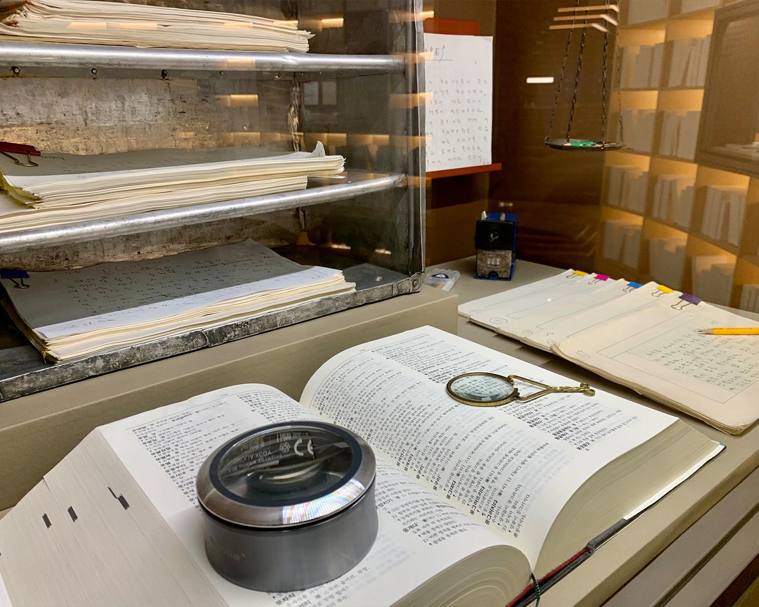 a thick book open and displayed at the permanent exhibition of songpa book museum