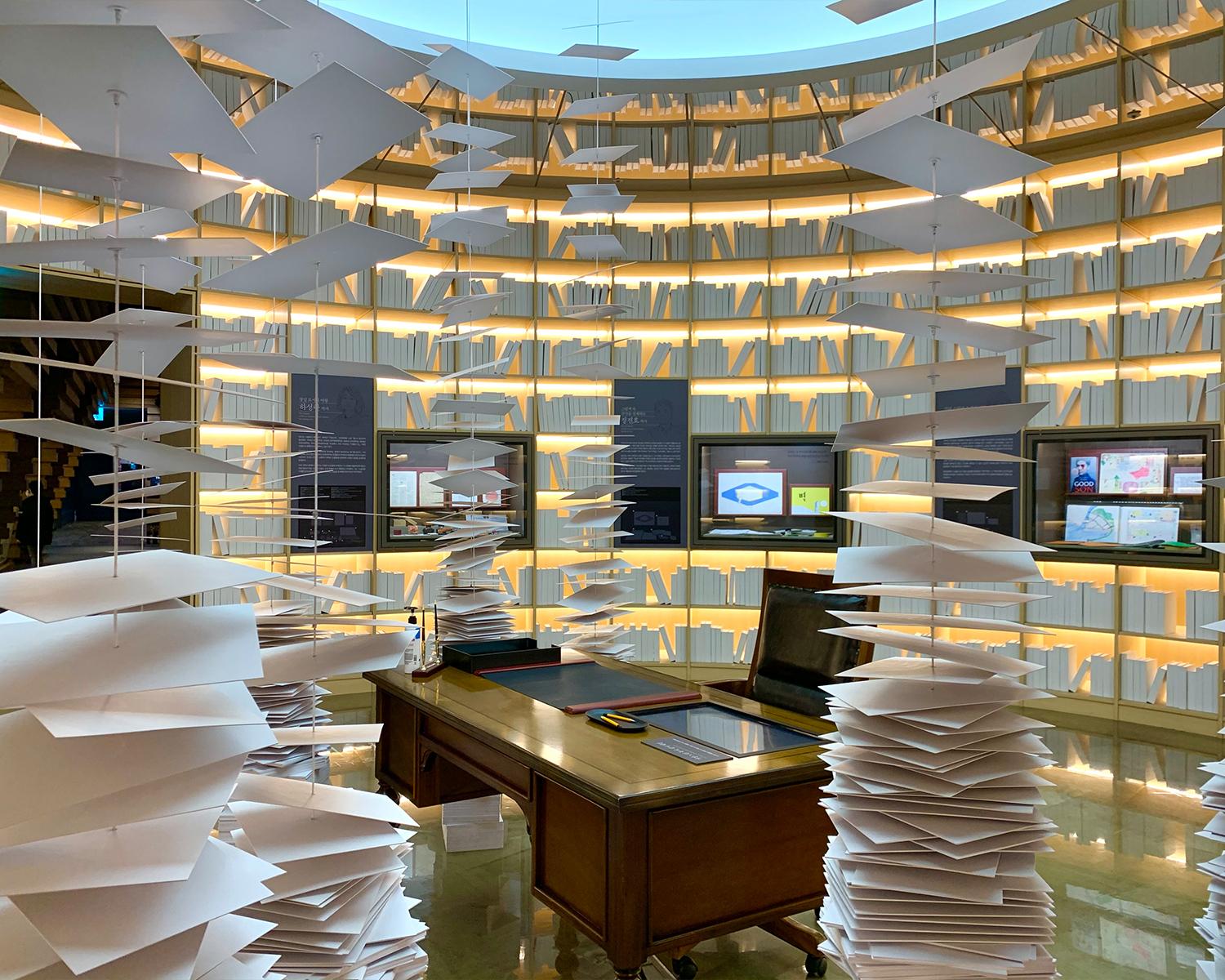 a book surrounded by loads of floating paper