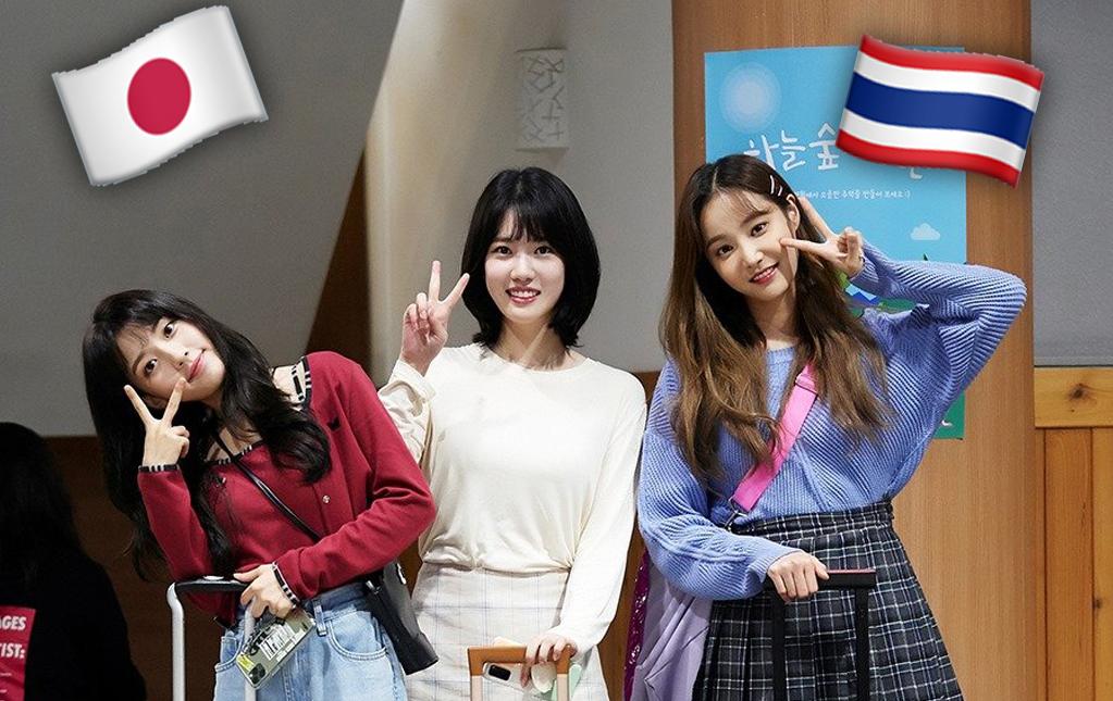 กลุ่มนักท่องเที่ยวพร้อมประเป๋าเดินทางที่เมืองเกาหลี สัญลักษณ์ธงไทยและธงญี่ปุ่นบนพื้นหลัง