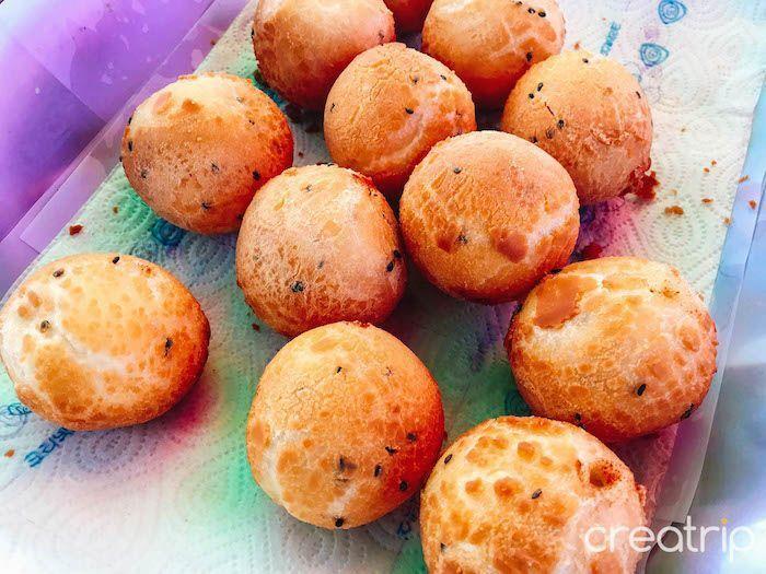 Crispy and golden-brown Korean-style fried snacks in a market setting, tantalizingly fresh and ready to eat.