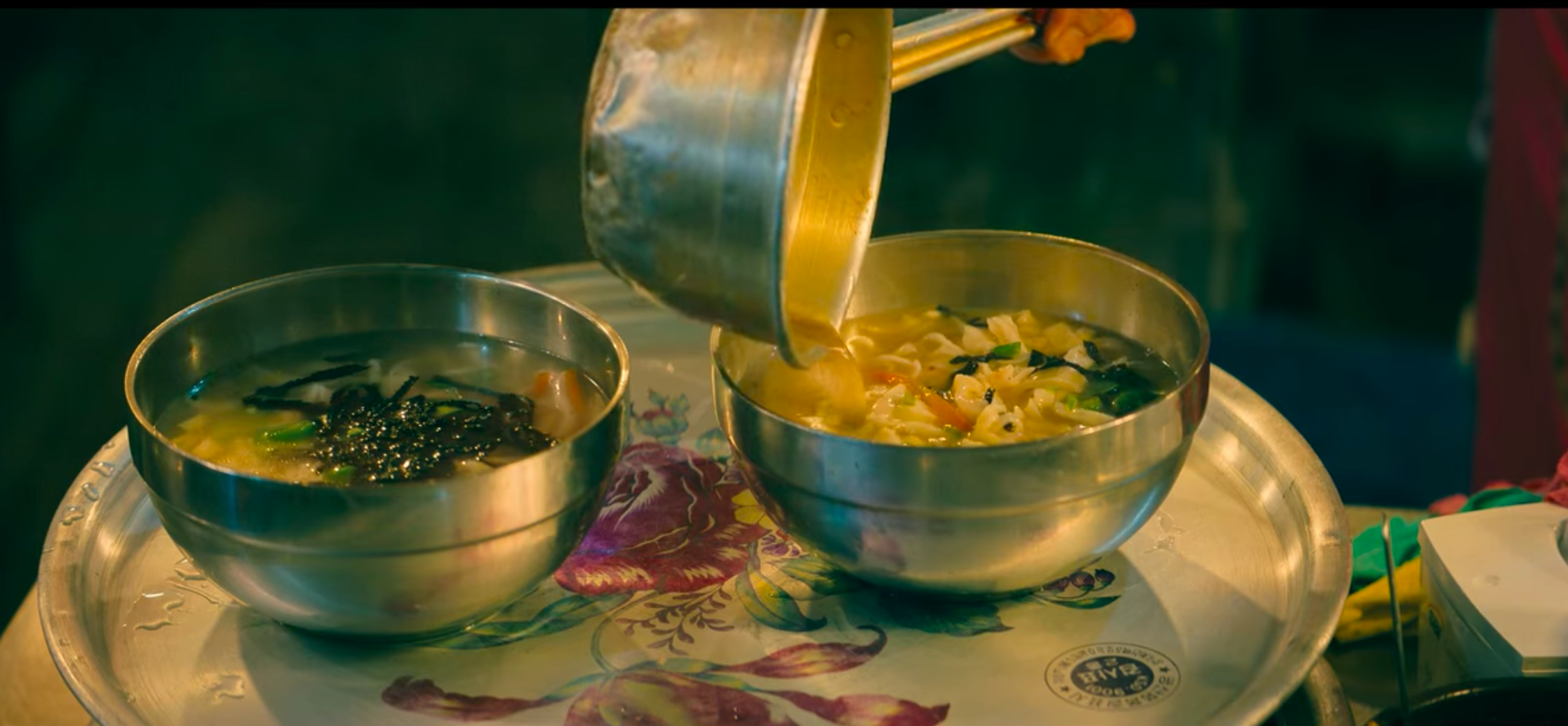 two bowls of kalguksu on a tray in gwangjang market