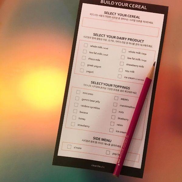 Selection of colorful cereal toppings at Midnight in Seoul, highlighting the café's creative and customizable breakfast options.