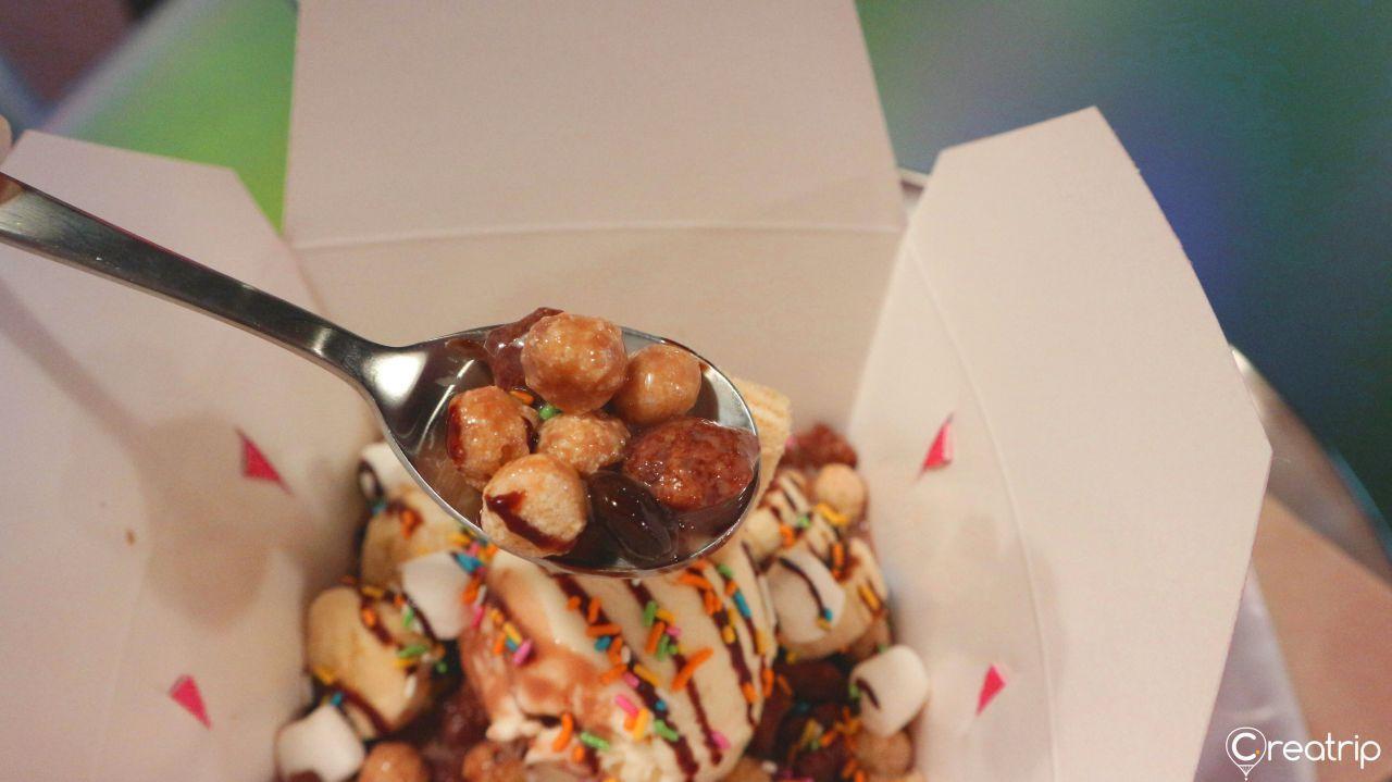 Diverse topping options provided at Midnight in Seoul café, allowing customers to customize their cereal experience.